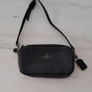 Coach Black Leather Clutch with Minimalist Design